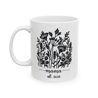 White mug with black floral illustration and "mama est. 2026" text.