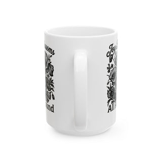 White mug with floral design and text "Joy all around".