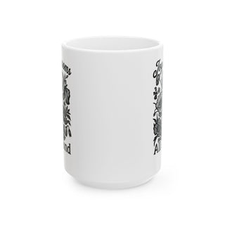 White mug with floral designs and "Joyful Blooms All Around" text.