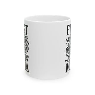 White mug with "First Birthday Mama" and floral designs.