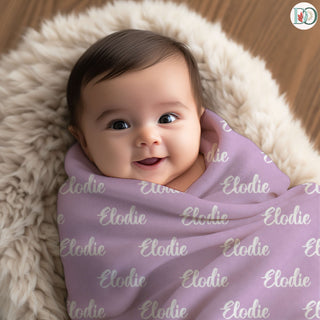 personalized name blankets in soft green, dusty lilac, deep rose, blush, and charcoal grey—each featuring a custom name in unique fonts for a cozy, heartfelt keepsake.