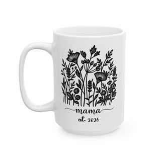 White mug with floral design and text "mama est. 2026".
