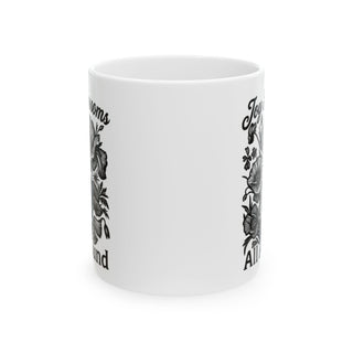 White mug with floral design and "Joy blooms all around" text.