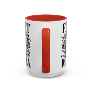 White mug with "First Mother's Day" design and red interior.