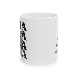 White mug with "AMA AMA AMA" in black lettering and decorative floral elements.