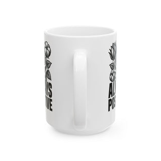 White mug with "Always Positive" text and floral designs.