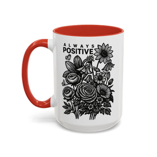 White mug with red interior and handle, featuring "ALWAYS POSITIVE" and floral line art.