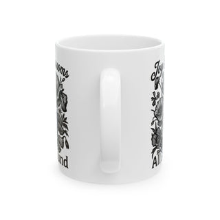 White mug with floral designs and text "Joyful blossoms" and "All around".
