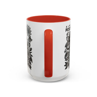 White mug with orange interior and floral design, "ALWYS POSITI" text.