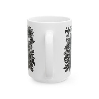 White ceramic mug with floral design and "ALWAYS POSITIVITY" text.