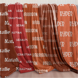 Personalized name blankets in cozy pumpkin, sienna, and sunset-inspired shades — each one a soft embrace from our Golden Hug Collection, designed to comfort, cheer, and celebrate with your chosen name and font.