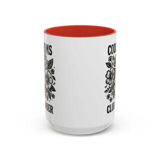 White mug with red interior, floral design and text "COOMBER CLUB".
