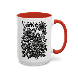 White mug with red handle featuring black floral illustration and "ALWAYS POSITIVE" text.