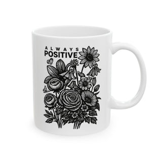 White mug with floral illustration and text "ALWAYS POSITIVE".