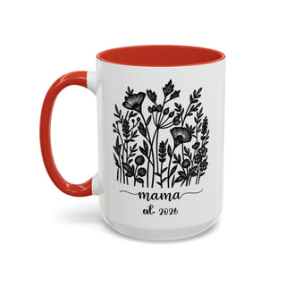 White mug with red interior and handle, featuring floral design and "mama est. 2026".