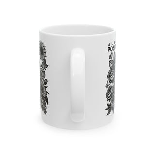 White mug with floral and butterfly designs and "ALWAYS POSI" text.