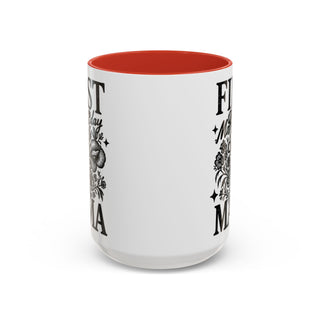 White mug with red interior, reads "First Mama" with floral accents.